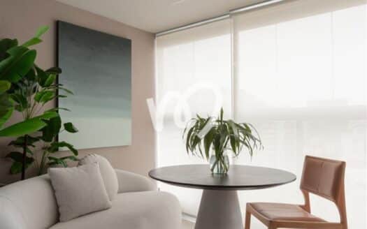 Seating corner with curved sofa and round table